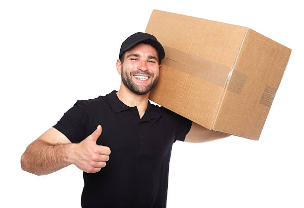 istock Smiling delivery man giving cardbox 494091139