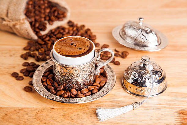 delicious turkish coffee - köpüklü türk kahvesi stok fotoğraflar ve resimler