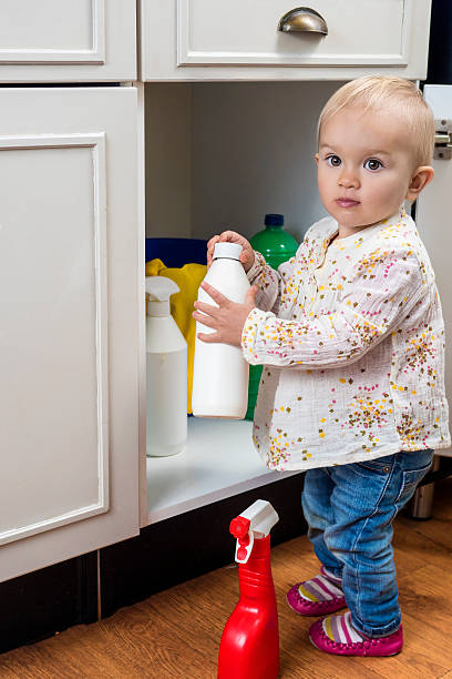 istock Toddler playing with cleaning products 494093688