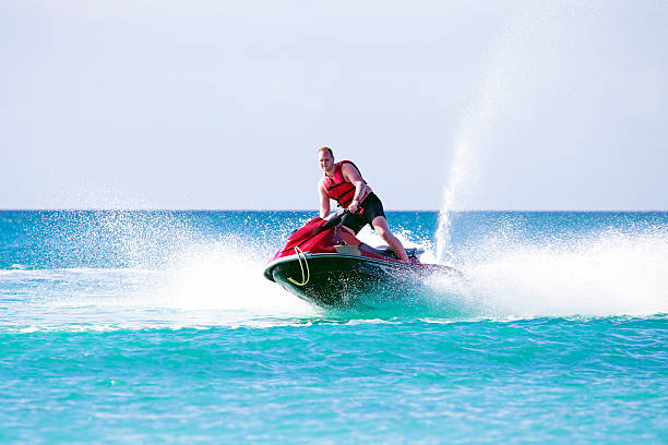 istock Young guy cruising on a jet ski 494094157