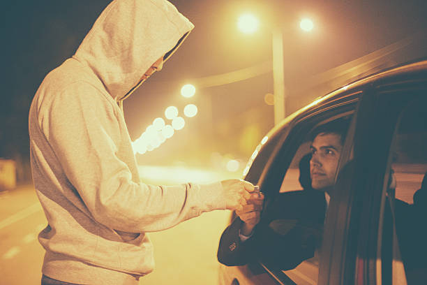 Drug abuse transaction Drug Sale,Pusher brings drugs to the car window to make his sale. drive through photos stock pictures, royalty-free photos & images