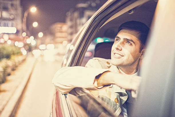 istock Businessman in a car at night 494094434