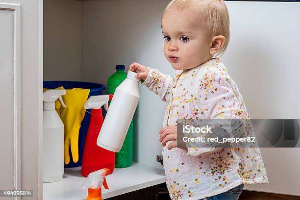 Little Girl Playing With Household Cleaners Stock Photo - Download Image Now - Child, Poisonous, Domestic Life