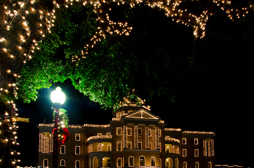 The Harrison County Courthouse is swathed in white lights for the Wonderland of Lights event in downtown Marshall, Texas.  Each year the town creates a Christmas wonderland with ice skating, carousel, train rides, Santa visits and Christmas lights everywhere!