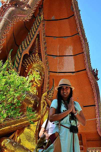istock Thai woman praying at Tiger Cave Temple 494097861
