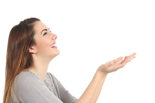 Profile of a happy woman holding something blank isolated on a white background