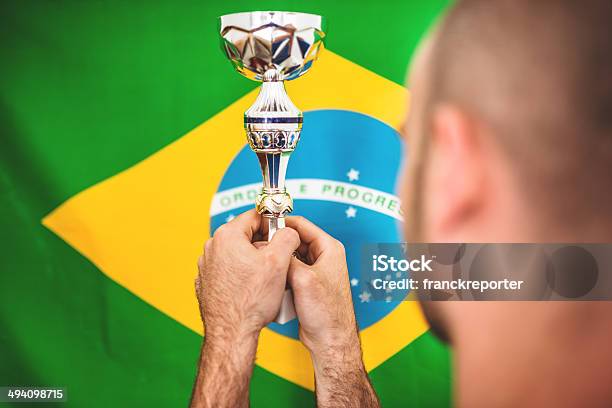 Brazilian Soccer Player Holding The Trophy Stock Photo - Download Image Now - 30-39 Years, Achievement, Adulation