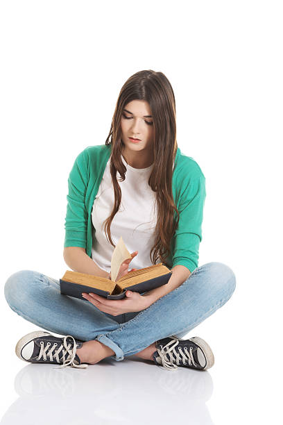 istock Young beautiful student sitting with book, reading, learning. 494118243