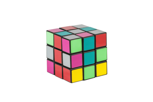 Aberfeldy, Scotland - March 17, 2014: Rubik's cube on a white background. Rubik's Cube invented by a Hungarian architect Erno Rubik in 1974.