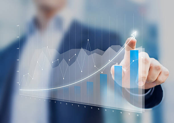Financial charts showing growing revenue on touch screen Financial charts showing growing revenue on touch screen revenue photos stock pictures, royalty-free photos & images