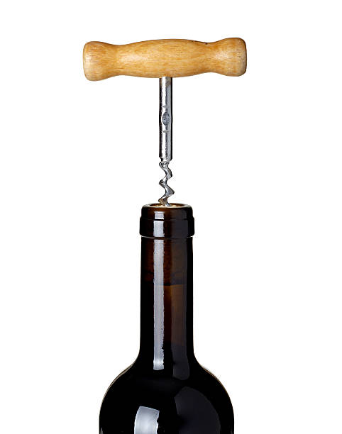 Senior man opening a wine bottle