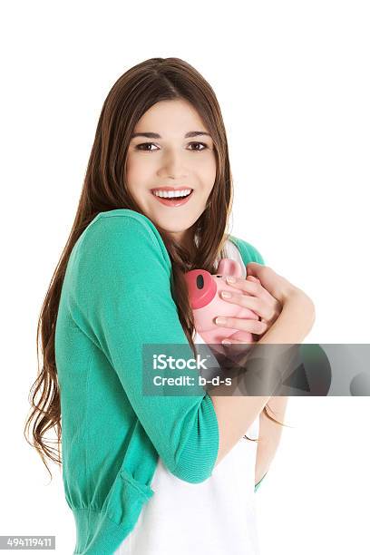 Young Casual Woman Holding Piggybank Stock Photo - Download Image Now - Coin, Holding, Women