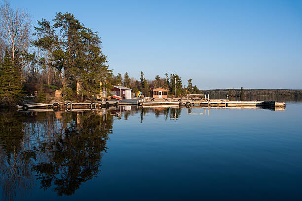 Scenic view of fishermen houses Scenic view of fishermen houses along shore of a lake in Kenora, Ontario kenora stock pictures, royalty-free photos & images