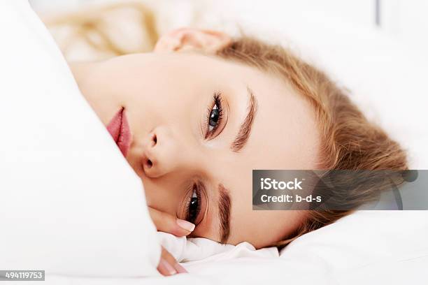 Beautiful Caucasian Woman Lying In Bed Stock Photo - Download Image Now - Adult, Adults Only, Beautiful People