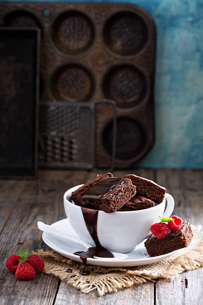 istock Brownies in stacked coffee cups with chocolate sauce 494120286