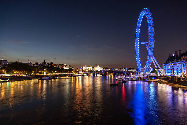 istock Thames river and London skyline at night 494120801