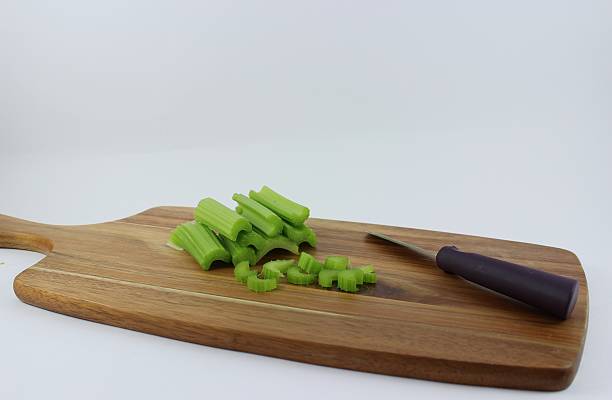 Celery On A Chopping Board stock photo