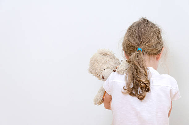 Little girl crying in the corner. Domestic violence concept. Little girl crying in the corner. Domestic violence concept. punishment photos stock pictures, royalty-free photos & images