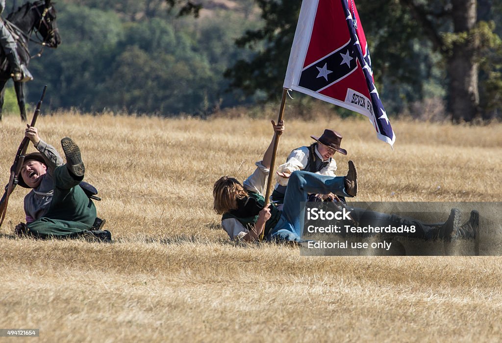 Taking Casualties Anderson, California, USA- October 3, 2015: Soldiers from an infantry unit from the Confederate Army take casualties  during a battle at the Civil War reenactment at Hawes Farm in northern California. 2015 Stock Photo