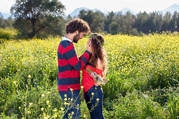 istock Loving young couple in a rapeseed field. 494121667