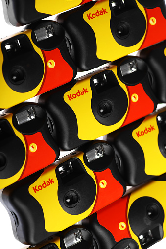 Bucharest, Romania - July 23, 2013: Picture of some disposable Kodak compact cameras. The one-time-use camera was pioneered by Kodak, an American multinational imaging and photographic equipment, materials and services company.