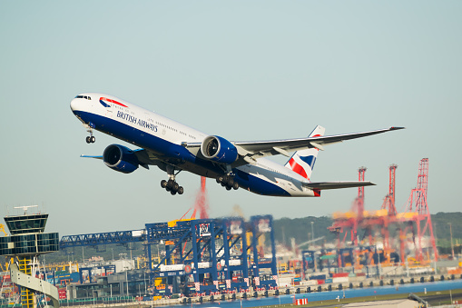 Sydney Australia May 19, 2014  Boeing 777 wearing British Airways livery  has just taking off from Kingsford Smith Airport on a clear day with very blue skies. The plane is bound for London