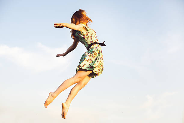 istock Happy Young Woman Jumping 494122821