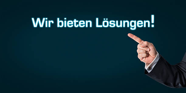 istock Business man pointing at the words -We offer solutions- 494123108