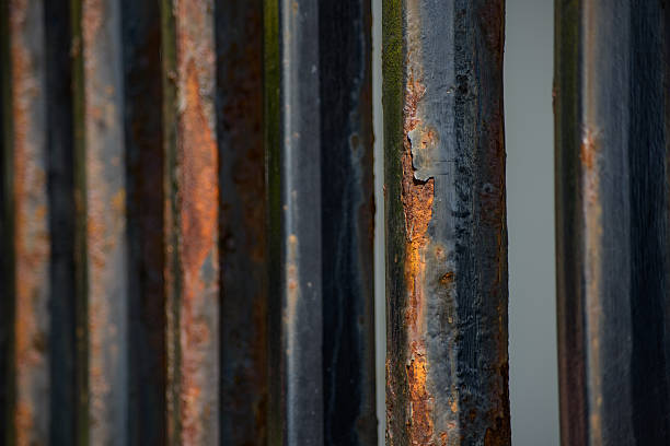 istock Rusty steel tubing with peeling paint oxidizing metal patterns a 494123268