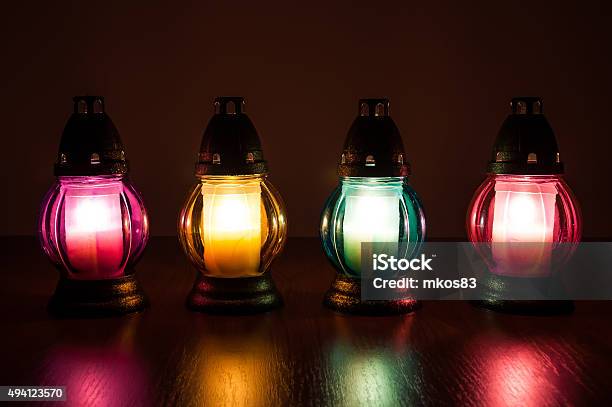 Burning Votive Candles In The Dark Stock Photo - Download Image Now - 2015, Blue, Burner - Stove Top