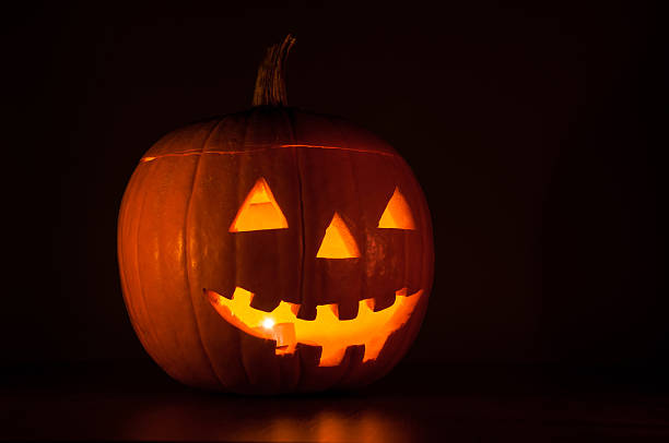 istock Halloween pumpkin glowing in the dark 494123940