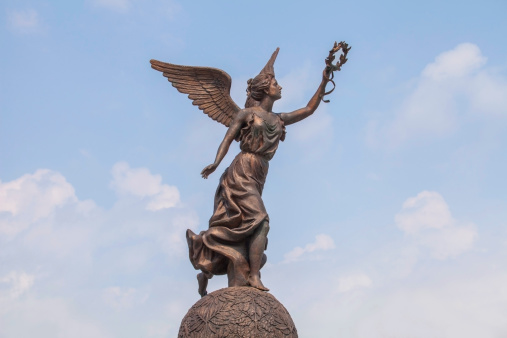 Monument to the Goddess of victory Nike in Kharkov against the clouds and sky.