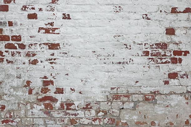istock Red Brick Wall With Damaged White Plaster Background 494127318