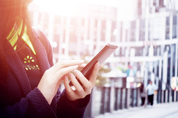 istock Close-up of woman's hands with smartphone 494127468