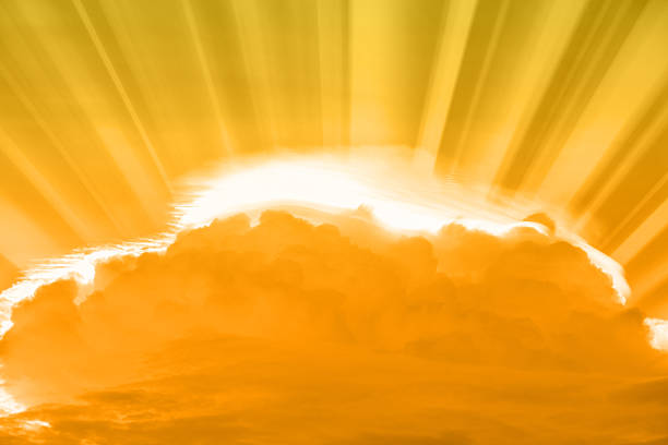 istock Gold sky rays of light shining down with clouds 494127624