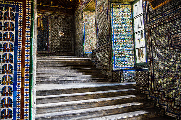 Exquisive tile work on stair case Exquisive tile work on stair case  - Royal Alcazar in Seville, Spain alcazar seville stock pictures, royalty-free photos & images