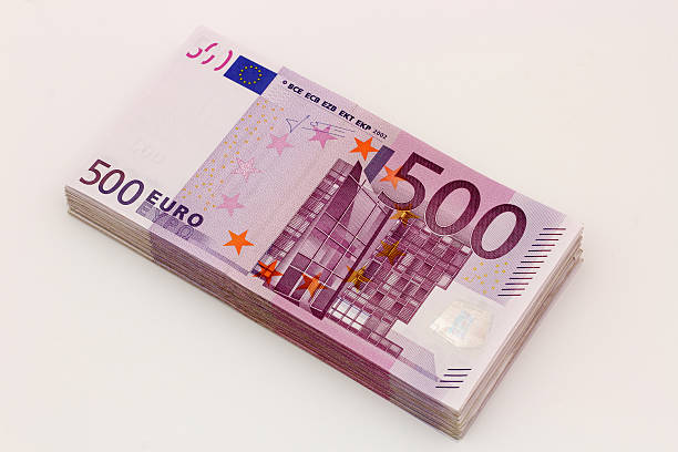 istock Isolated stack of 500 euro bills banknotes with white background 494133788
