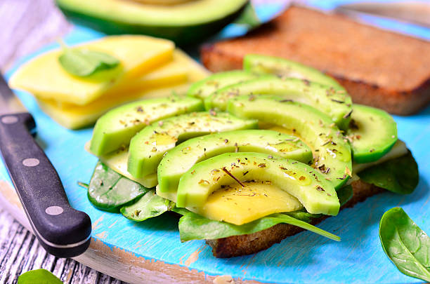 istock Sandwich with avocado,cheese and spinach leaves. 494134262