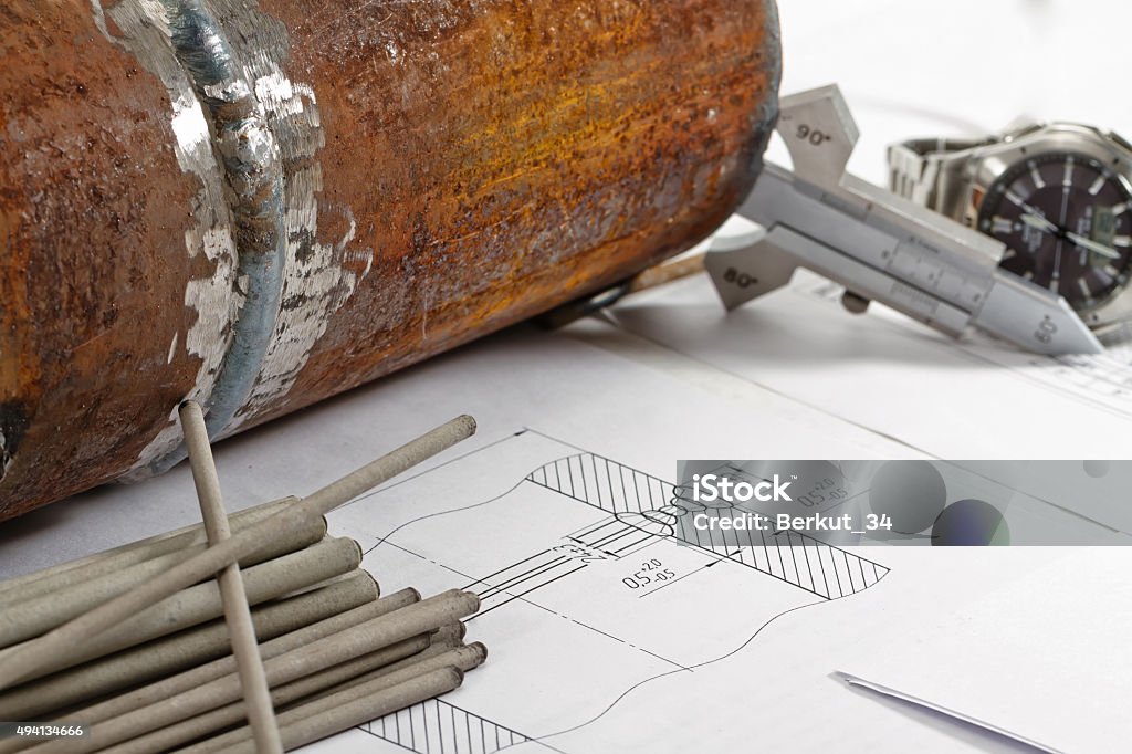 Electrodes for manual arc welding Welding electrodes are either side of a sketch made as a model and template for visually measuring control 2015 Stock Photo