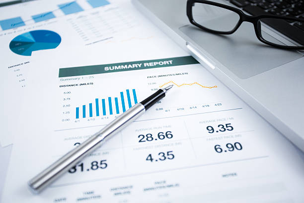 istock Businessman analyzing investment charts with laptop 494145051