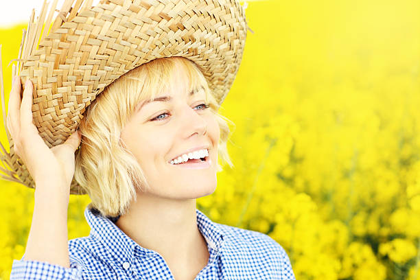 istock Happy woman on a yellow rape field 494145367