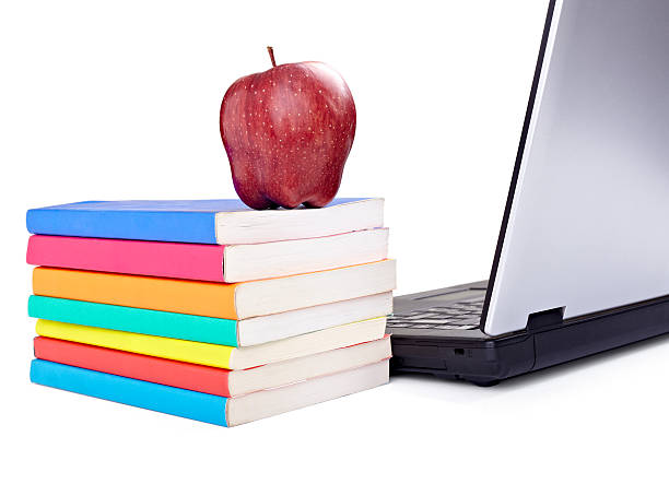 istock laptop computer books apple fruit food education school 494145477