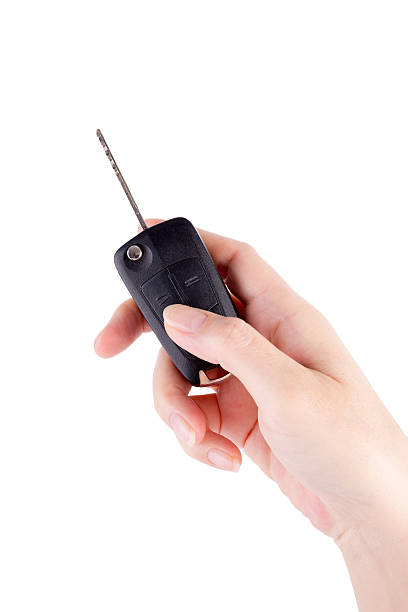 istock Hand holding car keys isolated on white background 494145751