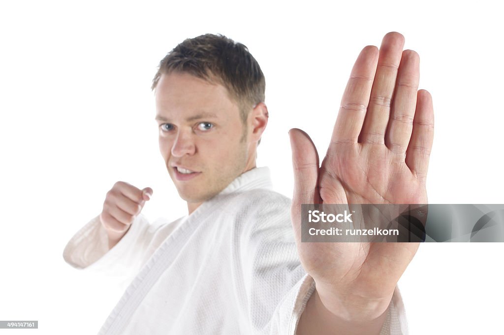 TaekwonDo Man doing TaekwonDo (Karate), isolated against white background Palm of Hand Stock Photo