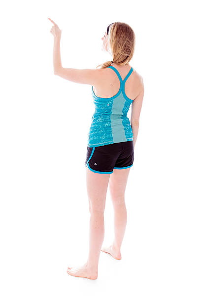istock Rear view of a young woman showing something 494147549