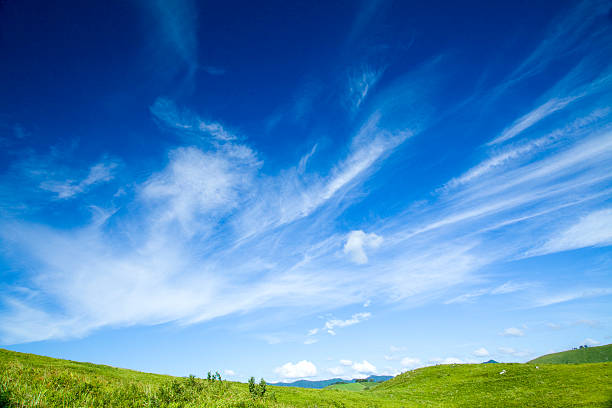 Green hill and cloud grassy plain hill and cirrus cloud cirrus stock pictures, royalty-free photos & images