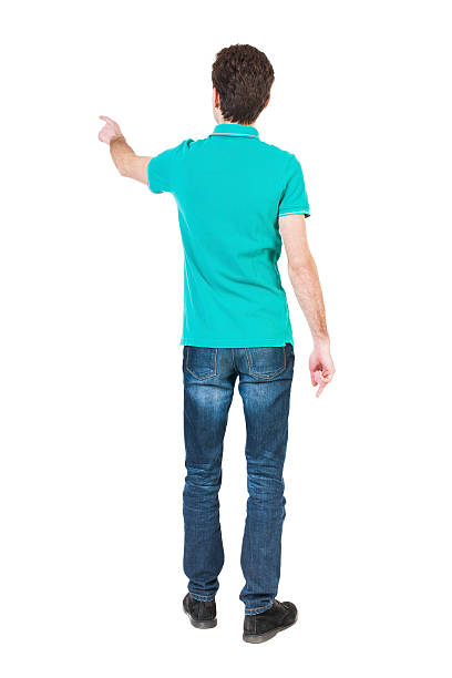 istock Back view of  pointing young men in  shirt and jeans. 494151492