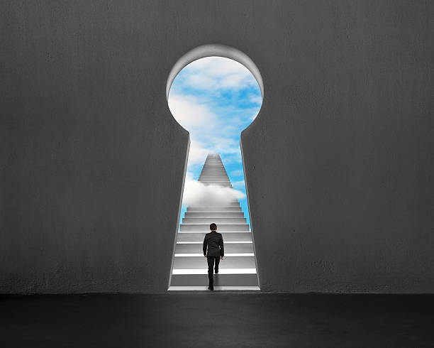istock Climbing on stairs with key shape hole and blue sky 494152369