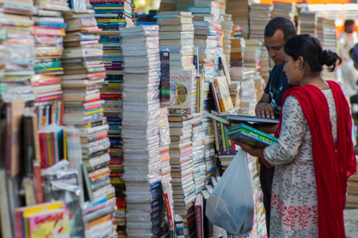Mumbai, India - April 13, 2013: An Indian couple in the afternoon at a local book market in Mumbai, India