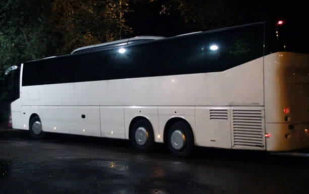 istock Parked White Passengers Tour Bus In The Night 494153236